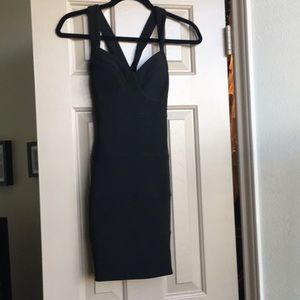 Black bodycon bandage cocktail dress.